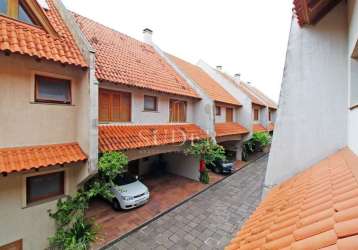 Casa em condomínio fechado com 3 quartos à venda na rua gilberto laste, 141, santa tereza, porto alegre por r$ 880.000