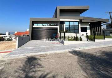 Casa de alto padrão com 3 suítes e piscina, à venda na pedra branca - palhoça/sc