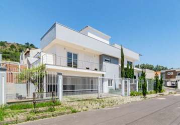 Casa com 4 quartos à venda na rua irmão jaime biazus, 100, guarujá, porto alegre por r$ 1.500.000