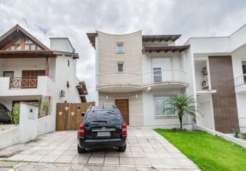 Casa em condomínio fechado com 3 quartos à venda na avenida edgar pires de castro, 540, aberta dos morros, porto alegre por r$ 1.100.000