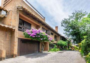 Casa em condomínio fechado com 4 quartos à venda na rua carlos júlio becker, 295, tristeza, porto alegre por r$ 1.100.000