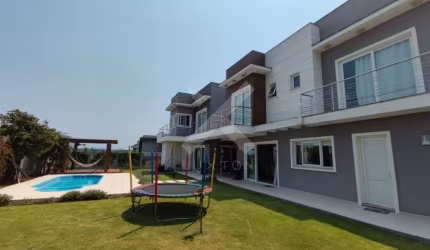Casa em condomínio fechado com 5 quartos à venda na Avenida AlphaVille, 2745, Alphaville, Gravataí por R$ 3.700.000