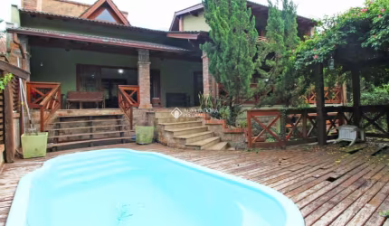 Casa em condomínio fechado com 4 quartos à venda na Rua Álamo, 86, São Lucas, Viamão, 420 m2 por R$ 900.000