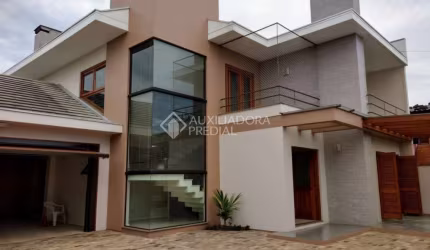 Casa em condomínio fechado com 3 quartos à venda na ALBANO HANSEN, 1542, Travessão, Dois Irmãos, 238 m2 por R$ 1.140.000