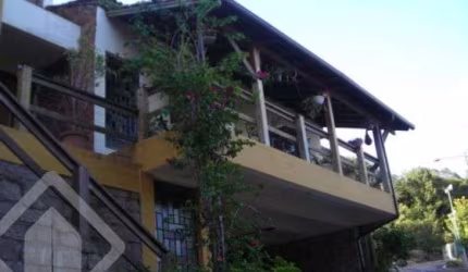 Casa com 4 quartos à venda na Acesso Hélio Alves da Rocha, 85, Vila Nova, Porto Alegre, 450 m2 por R$ 2.500.000