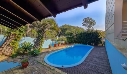 Casa em condomínio fechado com 4 quartos à venda na Rua Dona Adda Mascarenhas de Moraes, 1167, Jardim Itu Sabará, Porto Alegre, 367 m2 por R$ 1.150.000