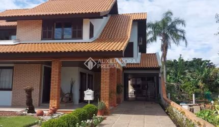 Casa com 4 quartos à venda na Avenida das Pitangueiras, 763, Daniela, Florianópolis, 166 m2 por R$ 2.120.000