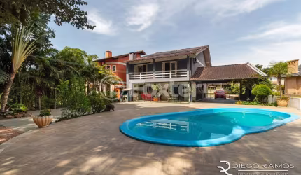 Casa em condomínio fechado com 3 quartos à venda na Rua Pau-brasil, 762, São Lucas, Viamão, 375 m2 por R$ 1.140.000