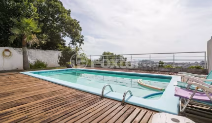 Casa com 4 quartos à venda na Rua Alcebíades Antônio dos Santos, 355, Nonoai, Porto Alegre, 420 m2 por R$ 1.700.000