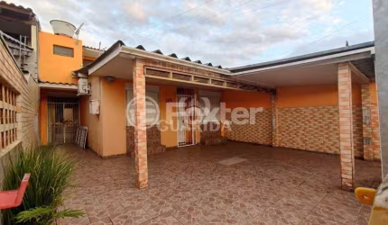 Casa com 3 quartos à venda na Rua Fabrício Valandro Roxo, 398, Jardim Algarve, Alvorada, 98 m2 por R$ 299.000