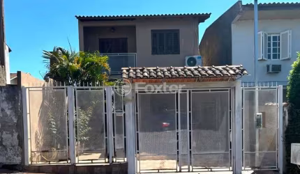 Casa com 3 quartos à venda na Rua Irmâ Arsênia Erthal, 61, Jardim Algarve, Alvorada, 161 m2 por R$ 475.000