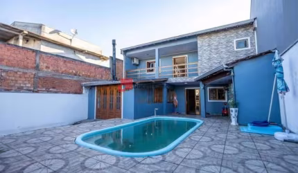 Casa com 3 quartos à venda na Rua dos Jaborandis, Igara, Canoas, 150 m2 por R$ 585.000