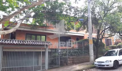 Casa com 4 quartos à venda na Rua Fonseca Guimarães, 34, Medianeira, Porto Alegre por R$ 1.350.000