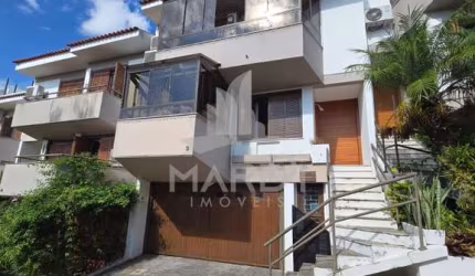 Casa em condomínio fechado com 3 quartos à venda na Avenida Jacuí, 740, Cristal, Porto Alegre por R$ 1.080.000