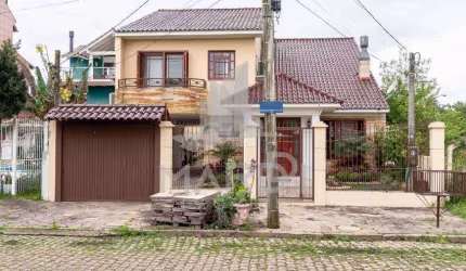 Casa com 3 quartos à venda na Avenida Guaíba, 13914, Ipanema, Porto Alegre por R$ 990.000