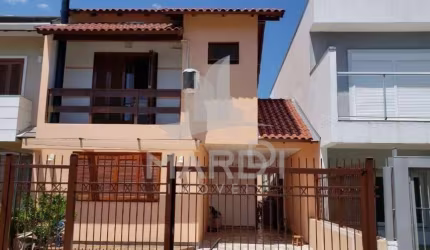 Casa em condomínio fechado com 3 quartos à venda na Rua Pau Brasil, 34, Hípica, Porto Alegre por R$ 550.000