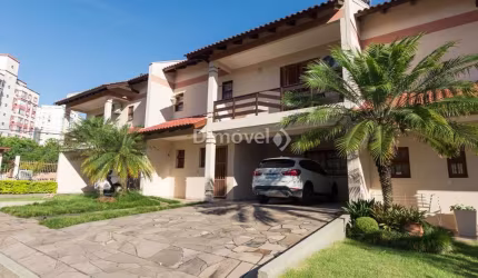 Casa em condomínio fechado com 3 quartos à venda na Avenida da Cavalhada, 4551, Cavalhada, Porto Alegre por R$ 840.000