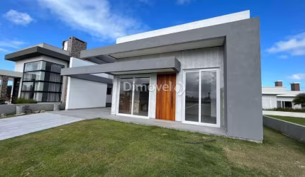 Casa em condomínio fechado com 3 quartos à venda na HONORIO GERMANO, 2009, Centro, Capão da Canoa por R$ 1.190.000