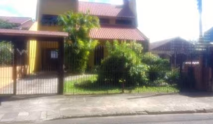 Casa em condomínio fechado com 4 quartos à venda na Rua Fernando Ferrari, 449, Piratini, Sapucaia do Sul por R$ 750.000