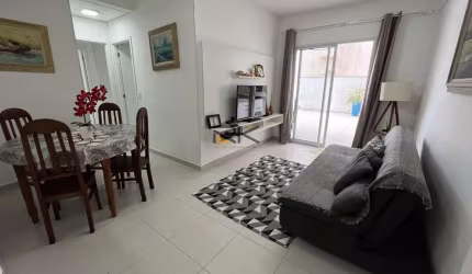 APARTAMENTO PRAIA GRANDE com 2 dormitórios sendo 1 suíte,1 vaga de garagem,varanda gourmet com churrasqueira,sala 2 ambientes