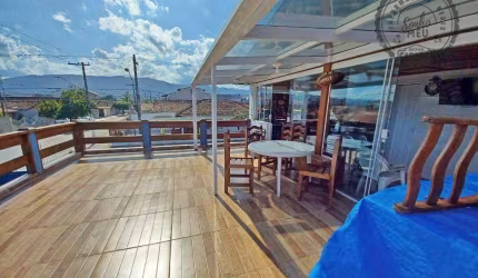 Sobrado com 3 dormitórios à venda, 142 m² por R$ 690.000,00 - Maracanã - Praia Grande/SP