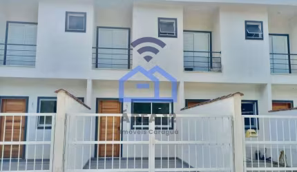 Sobrado à venda no bairro do Massaguaçu em Caraguatatuba, SP - 2 suítes, 1 lavabo, sala, cozinha, s