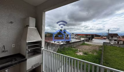 Apartamento à venda no bairro Tarumãs em Caraguatatuba, SP - 70m² com dois dormitórios, sala, cozin