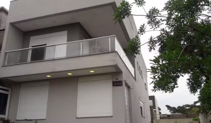 Casa em condomínio fechado com 3 quartos à venda na Rua Silvino Nedel, 240, Alto Petrópolis, Porto Alegre por R$ 719.000