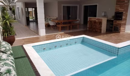 Casa com 4/4 em Alphaville Litoral Norte 1