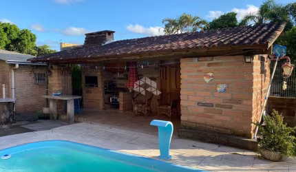 Casa com 4 quartos à venda na Artur Antônio Da Silva, 117, Araça, Capão da Canoa por R$ 532.000