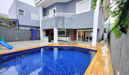 Linda casa em condomínio fechado com 5 suítes na região da praia do Pernambuco no Guarujá!