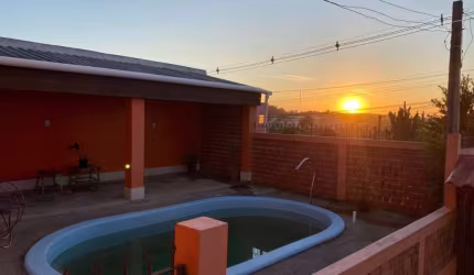 Casa com 3 quartos à venda na Avenida Tiradentes, 970, Aparecida, Alvorada por R$ 450.000