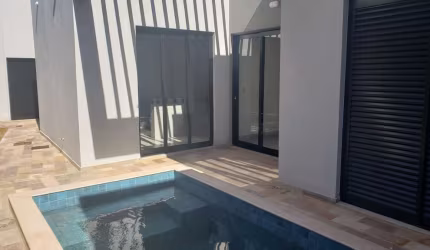 Casa em condomínio fechado com 3 quartos à venda no Grand Ville, Uberlândia  por R$ 1.260.000