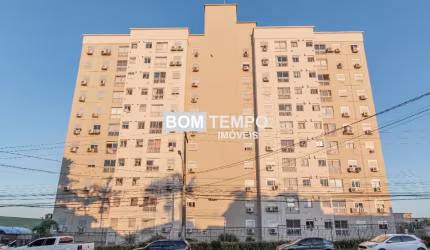 2 dormitórios um suíte Box coberto. Andar alto