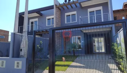 Sobrado com 3 dormitórios à venda, 112 m² por R$ 630.000,00 - Girassol - Gravataí/RS