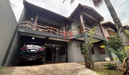 Sobrado com 4 dormitórios à venda, 320 m² por R$ 1.170.000 - Girassol - Gravataí/RS
