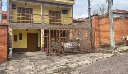 Casa com 4 quartos à venda na Rua dos Cardeais, 130, Jardim Algarve, Alvorada por R$ 450.000