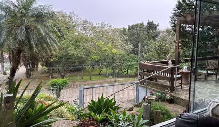 Casa com 3 quartos à venda na Rua Edgar Luiz Schneider, 480, Jardim Isabel, Porto Alegre por R$ 1.250.000