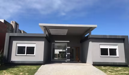 Casa em condomínio fechado com 4 quartos à venda na Rua Onório Germano, 2009, Araça, Capão da Canoa por R$ 1.560.000
