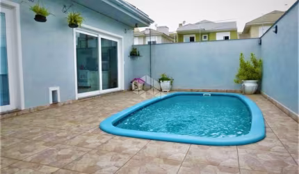 Casa 3 dormitórios, 2 suítes, 4 vagas com piscína, bairro Mont Serrat Canoas -Rs