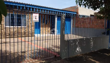 Terreno com 3 casas à venda no bairro Mathias Velho