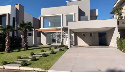 Casa em condomínio fechado, com 3 dormitórios/suítes, 4 vagas de garagem, no Central Parque em Cachoeirinha RS