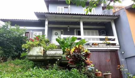 Casa com 5 quartos  à  Venda, Vila Nova, Porto Alegre.