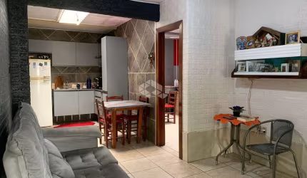 TERRENO COM DUAS CASAS EM TORRES
