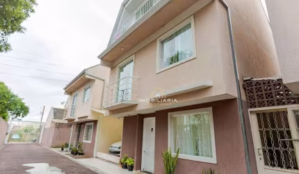 Sobrado com 3 dormitórios à venda, 156 m² por R$ 580.000 - Uberaba - Curitiba/PR