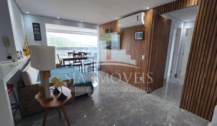 Cobertura duplex pé na areia à venda no centro de Bertioga,  136m² ,  2 dormitórios sendo 1 suíte e 2 vagas cobertas + deposito.