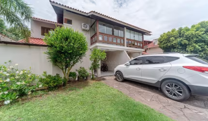 Casa em condomínio fechado com 3 quartos à venda na Avenida Eduardo Prado, 2050, Cavalhada, Porto Alegre por R$ 1.200.000