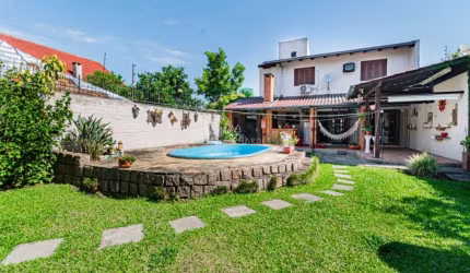 Casa com 3 quartos à venda na Avenida Guarujá, 140, Guarujá, Porto Alegre por R$ 750.000