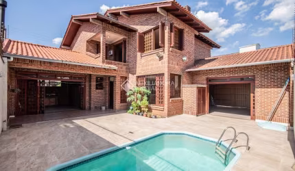 Casa com 4 quartos para alugar na Rua Tobias Barreto, 449, Nossa Senhora das Graças, Canoas, 286 m2 por R$ 11.000
