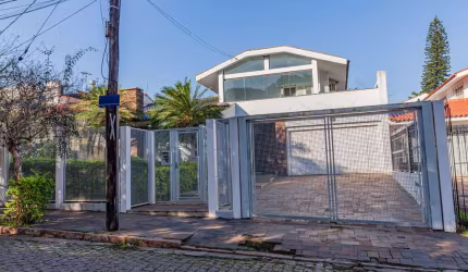 Casa com 3 quartos à venda na Rua Trujilo, 95, Jardim Lindóia, Porto Alegre por R$ 1.190.000